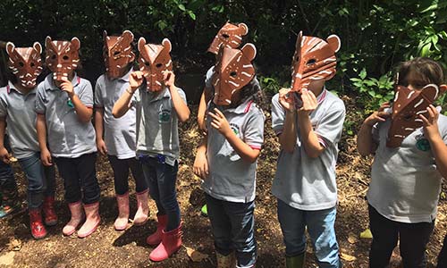 children with tapir masks
